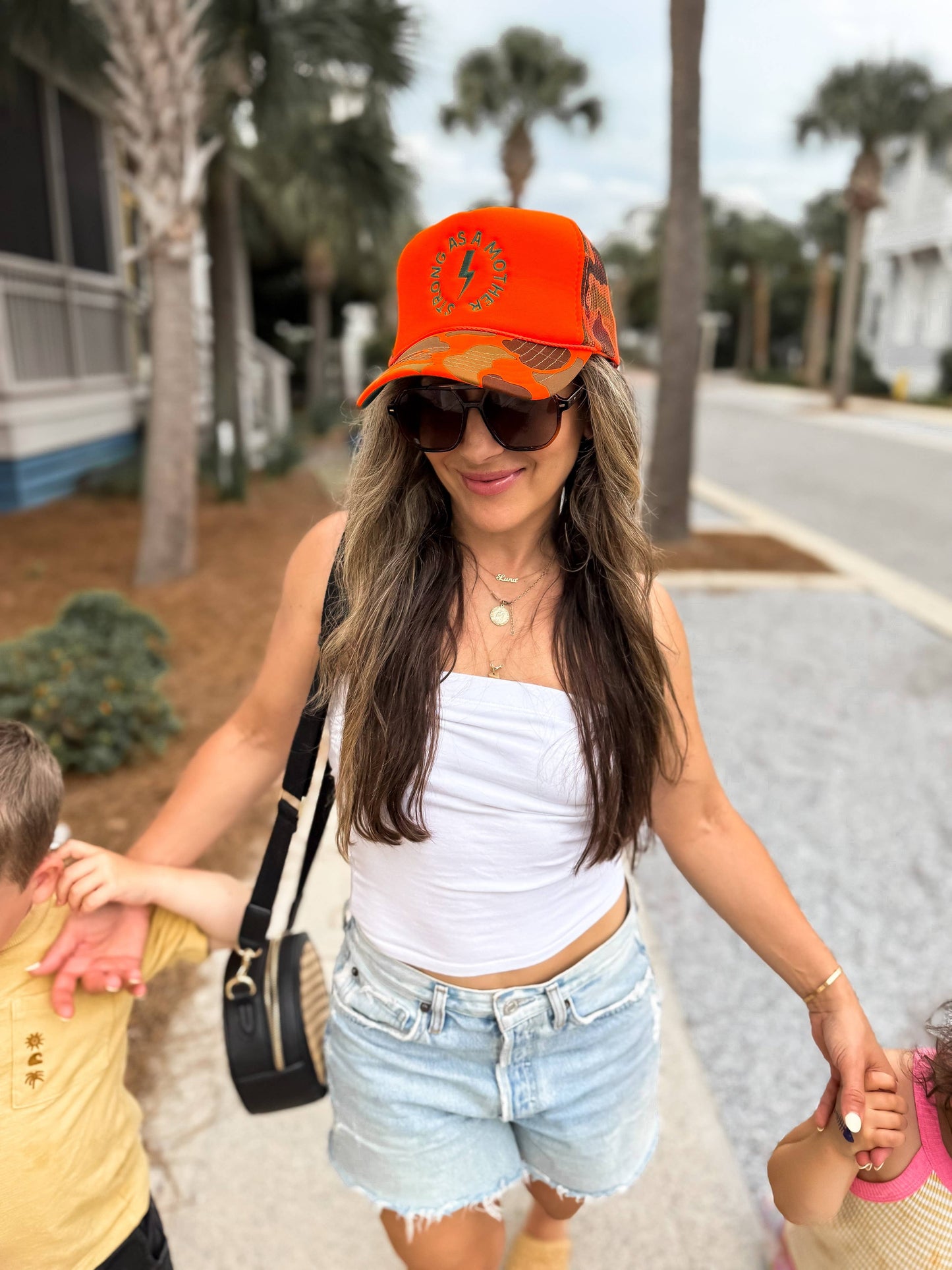 Strong as a mother™ Embroidered Trucker Hat - Neon Orange Camo